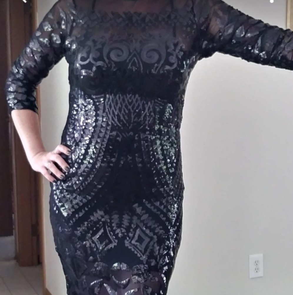 Beautiful sheer mesh dress with beads and sequins.